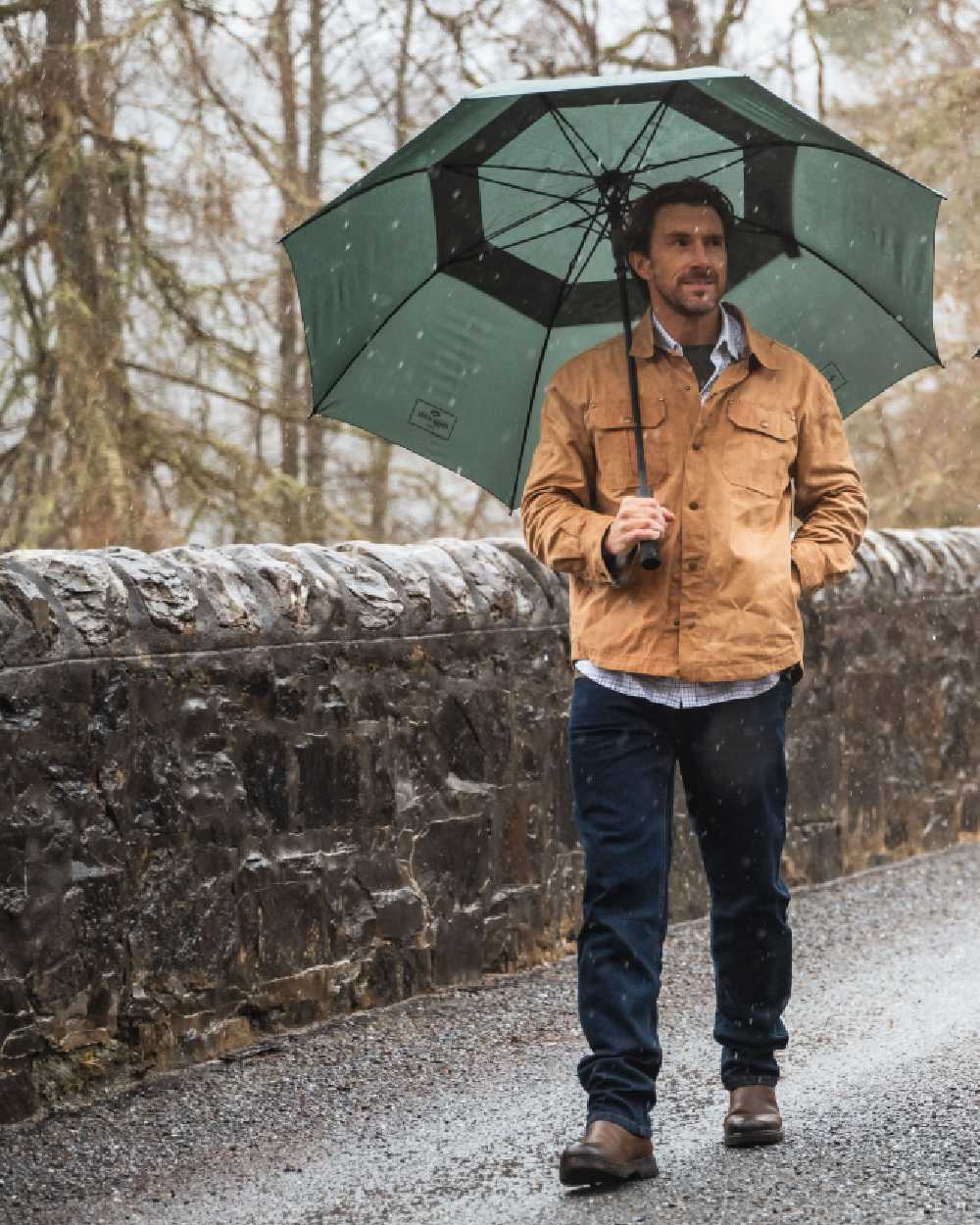 Tan Coloured Hoggs of Fife Mens Huntly Waxed Canvas Utility Overshirt on forest background #colour_tan