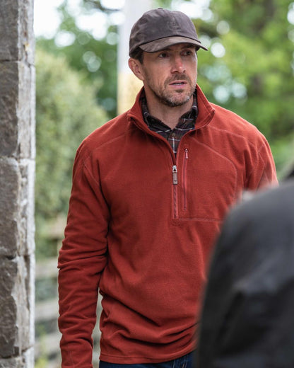 Burnt Henna Coloured Hoggs of Fife Mens Islander Techpro Quarter Zip Shirt on outdoor background #colour_burnt-henna