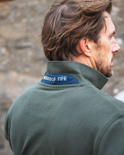 Forest Coloured Hoggs of Fife Mens Newton Pique Polo Shirt on blurry background #colour_forest