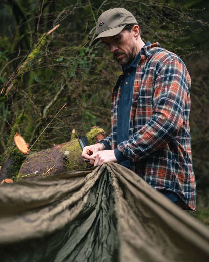 Green Rust Check Coloured Hoggs of Fife Mens Pitcairn Flannel Check Shirt on forest background #colour_green-rust-check