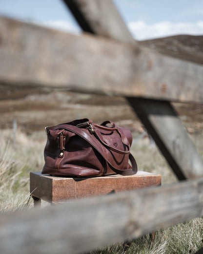 Conker Coloured Hoggs of Fife Monarch Leather Carryon Holdall on outdoor background #colour_conker