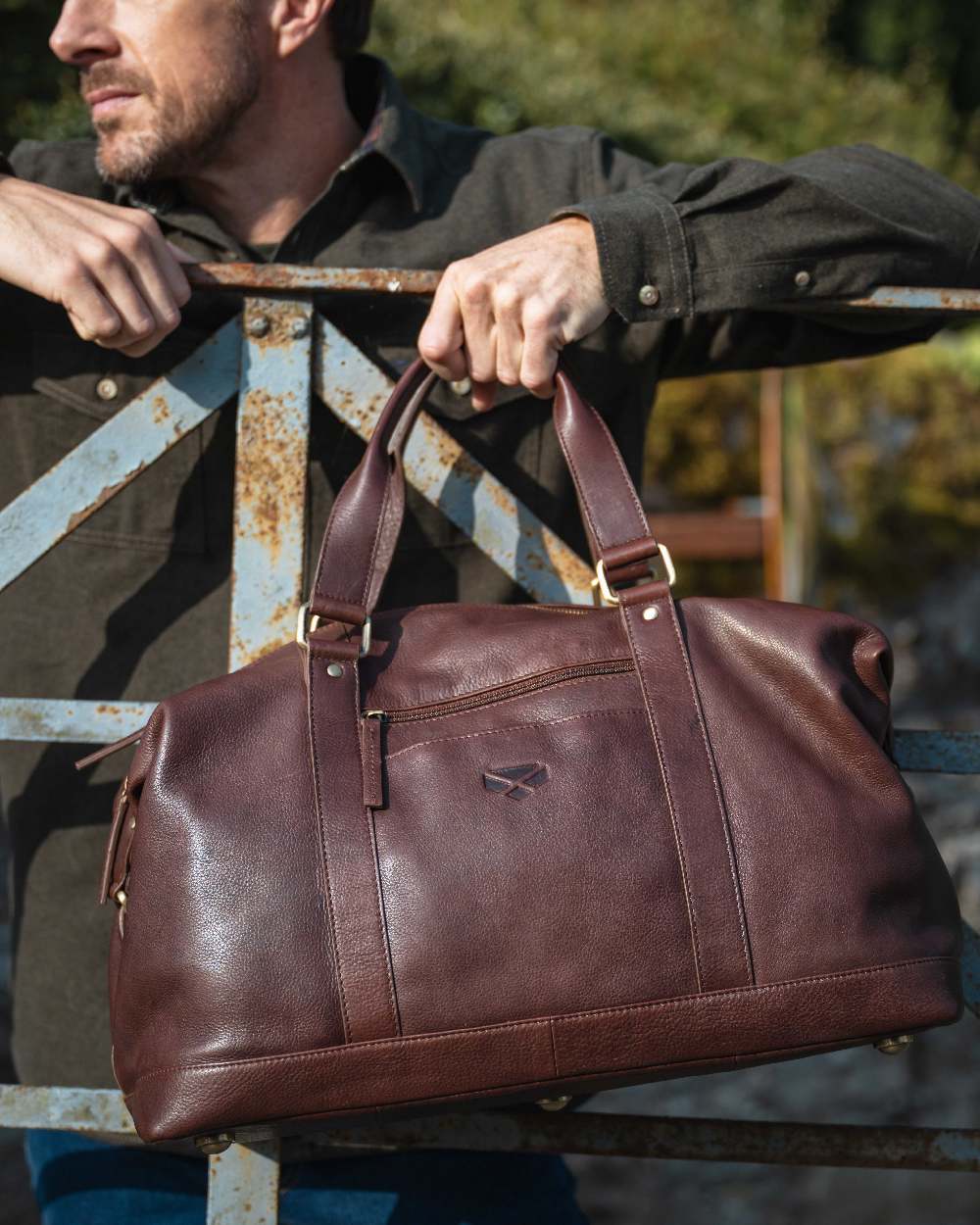 Conker Coloured Hoggs of Fife Monarch Leather Carryon Holdall on outdoor background #colour_conker