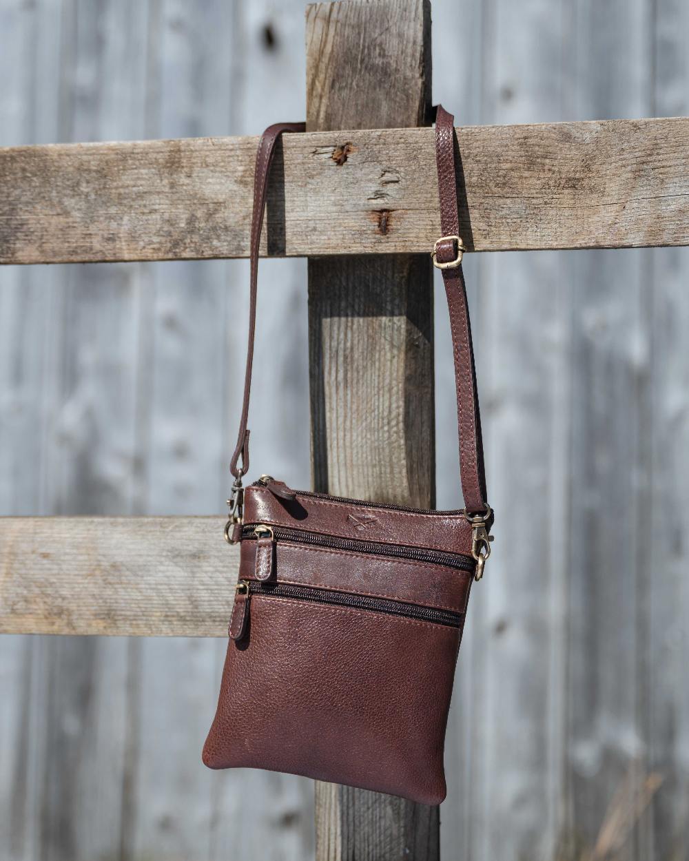 Conker Coloured Hoggs of Fife Monarch Leather Travel Organiser on outdoor background #colour_conker