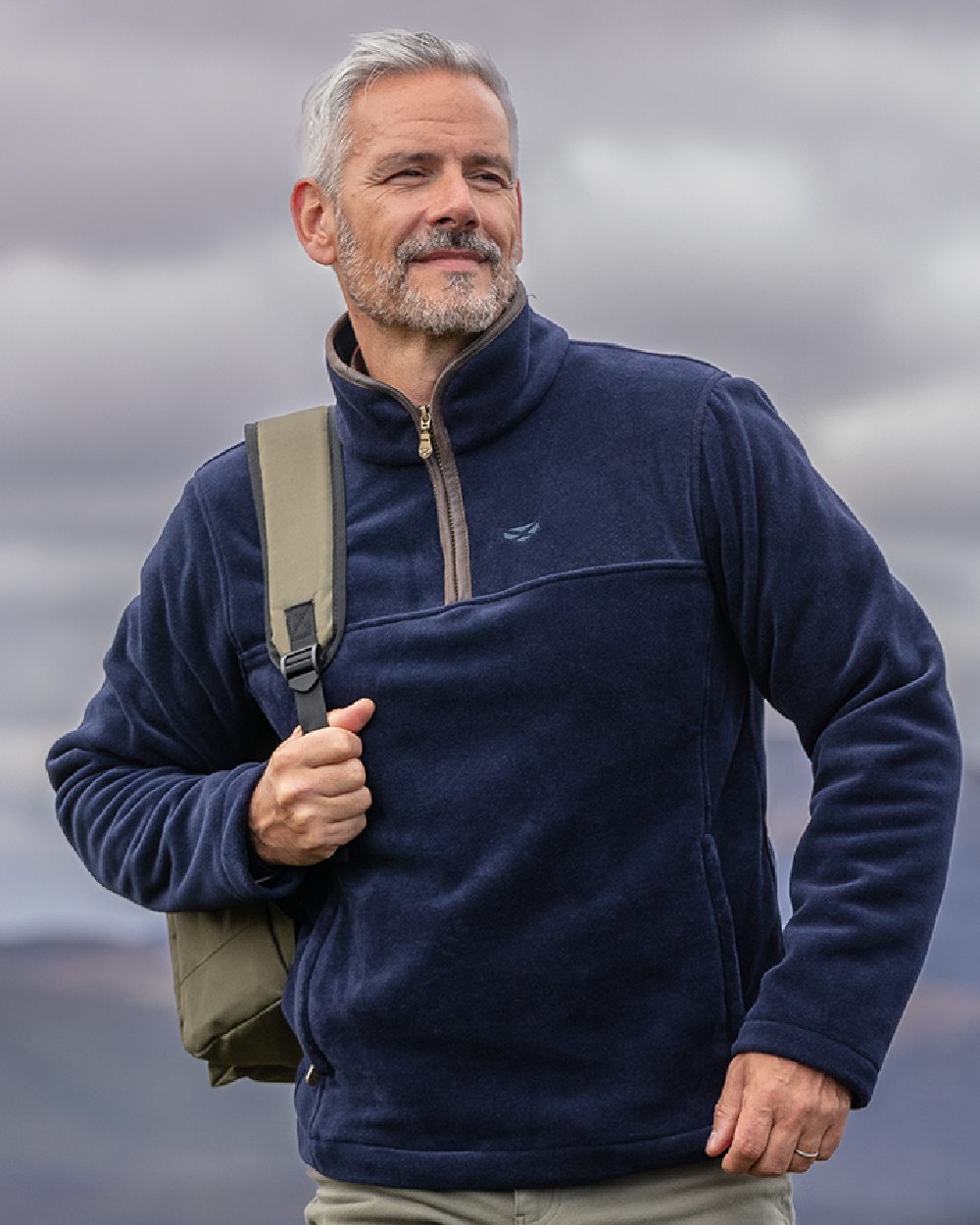 Midnight Navy Coloured Hoggs of Fife Stenton Quarter Zip Fleece on blurry background #colour_midnight-navy