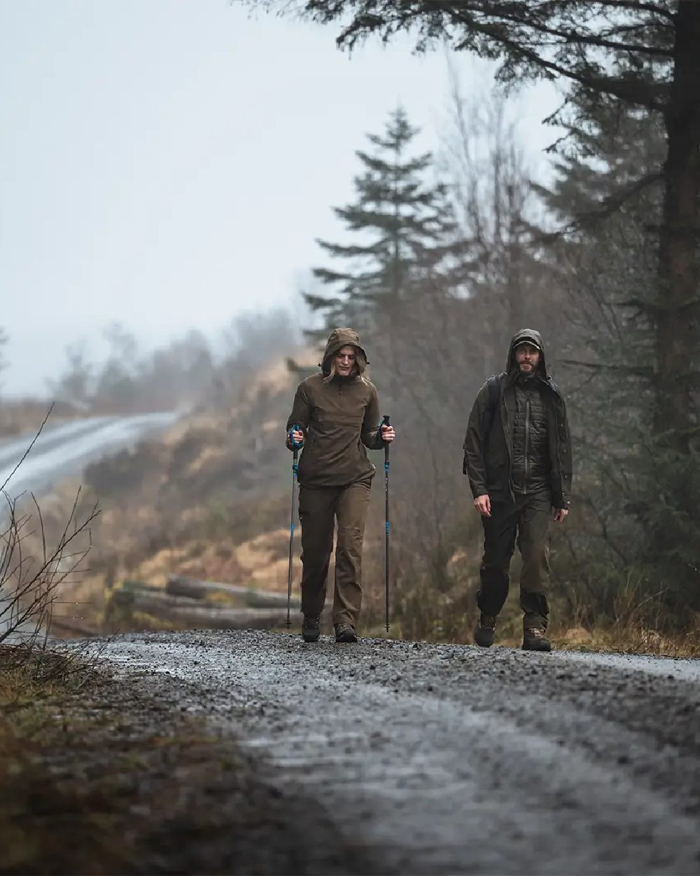 Sage Coloured Hoggs of Fife Struther Ladies Waterproof Trousers on forest background #colour_sage