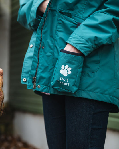 Teal Coloured Hoggs of Fife Womens Fara Waterproof Jacket on blurry background #colour_teal