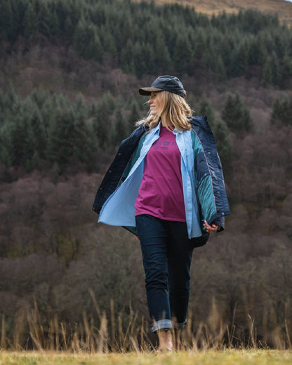 Blue White Coloured Hoggs of Fife Womens Ingliston Stretch Stripe Shirt on mountain background #colour_blue-white