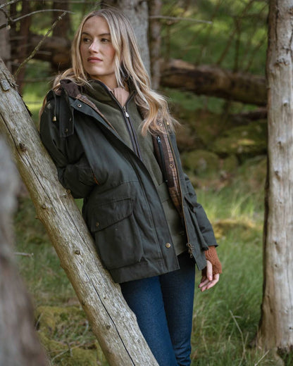 Forest Green Coloured Hoggs of Fife Womens Kelso Waterproof Waxed Jacket on outdoor background #colour_forest-green