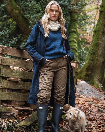 Navy coloured Hoggs of Fife Womens Walker Long Coat on forest background #colour_navy