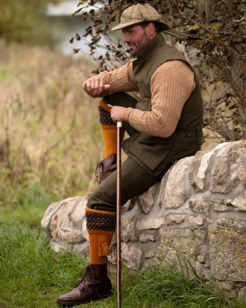Ochre coloured House of Cheviot Angus Socks on field background #colour_ochre