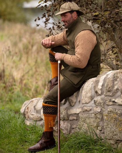 Ochre coloured House of Cheviot Angus Socks on field background #colour_ochre