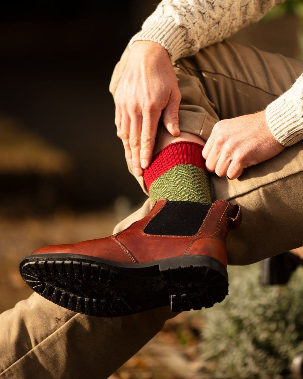 Brick Red coloured House of Cheviot Herringbone Short Socks on blurry background #colour_brick-red