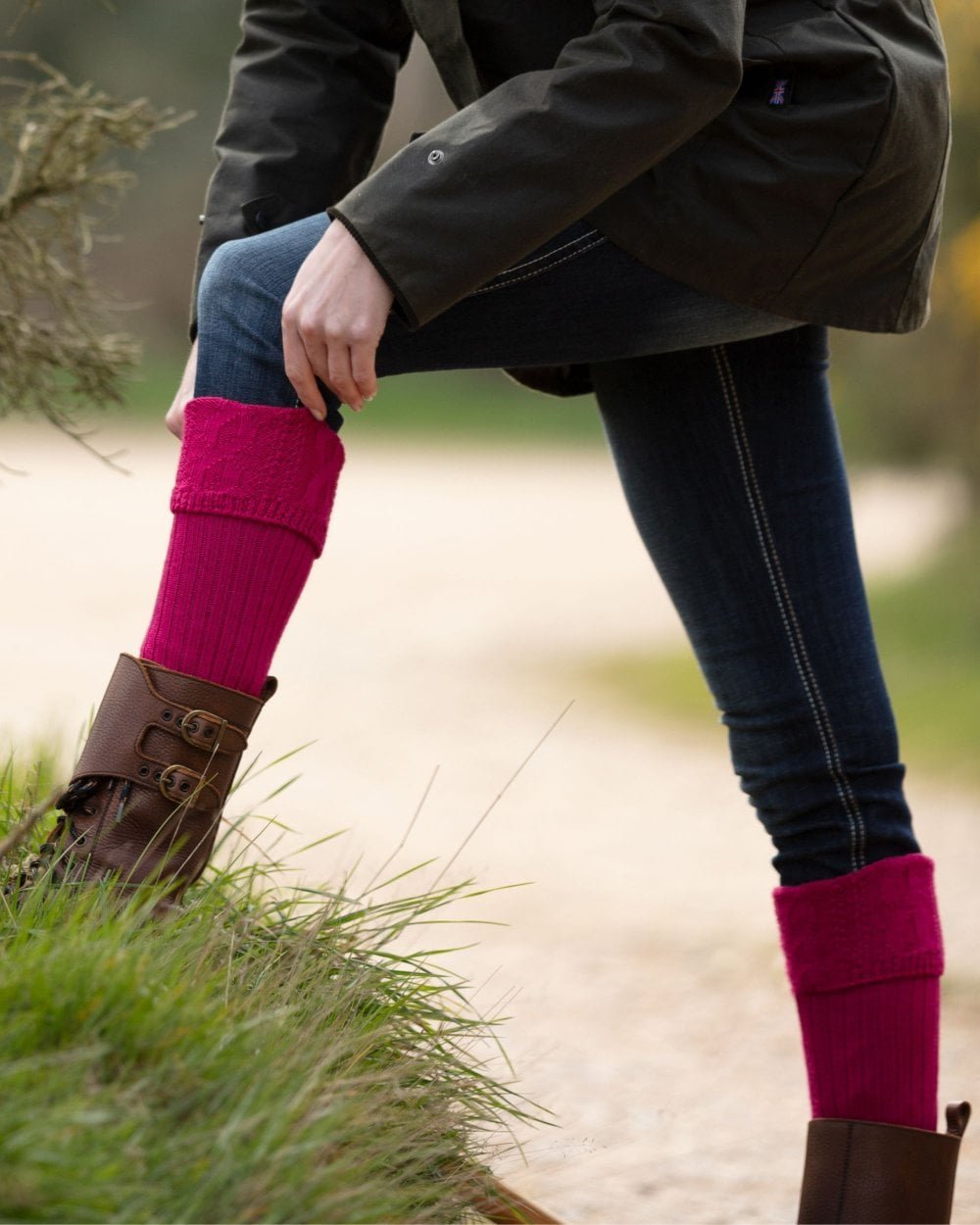 Fuchsia coloured House of Cheviot Lady Glenmore Socks on blurry background #colour_fuchsia