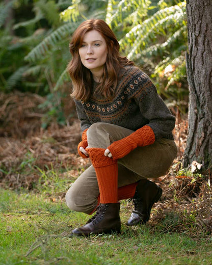 Burnt Orange coloured House of Cheviot Lady Rannoch Socks on field background #colour_burnt-orange
