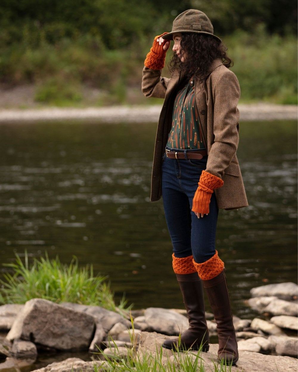 Burnt Orange coloured House of Cheviot Lady Rannoch Socks on river background #colour_burnt-orange