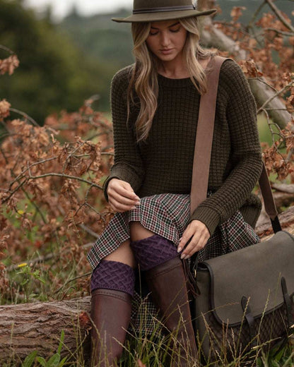 Thistle coloured House of Cheviot Lady Rannoch Socks on blurry background #colour_thistle