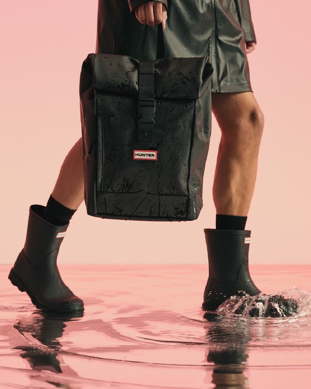 Black Coloured Hunter Mens Downpour Short Boots on water background #colour_black
