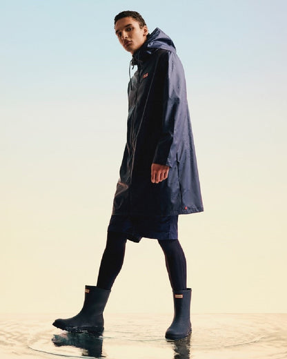 Hunter Navy Coloured Hunter Mens Downpour Short Boots on water background #colour_hunter-navy