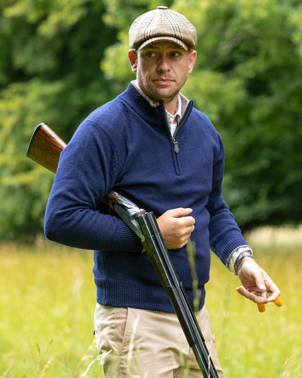 Navy coloured Jack Pyke Ashcombe Lambswool Zip Knit Pullover on forest background #colour_navy