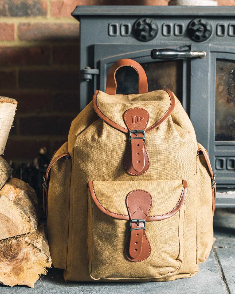 Fawn coloured Jack Pyke Canvas Day Pack on wall background #colour_fawn