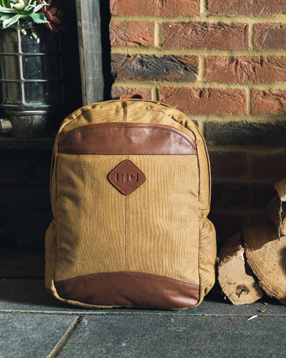 Fawn coloured Jack Pyke Canvas Field Pack on brick wall background #colour_fawn