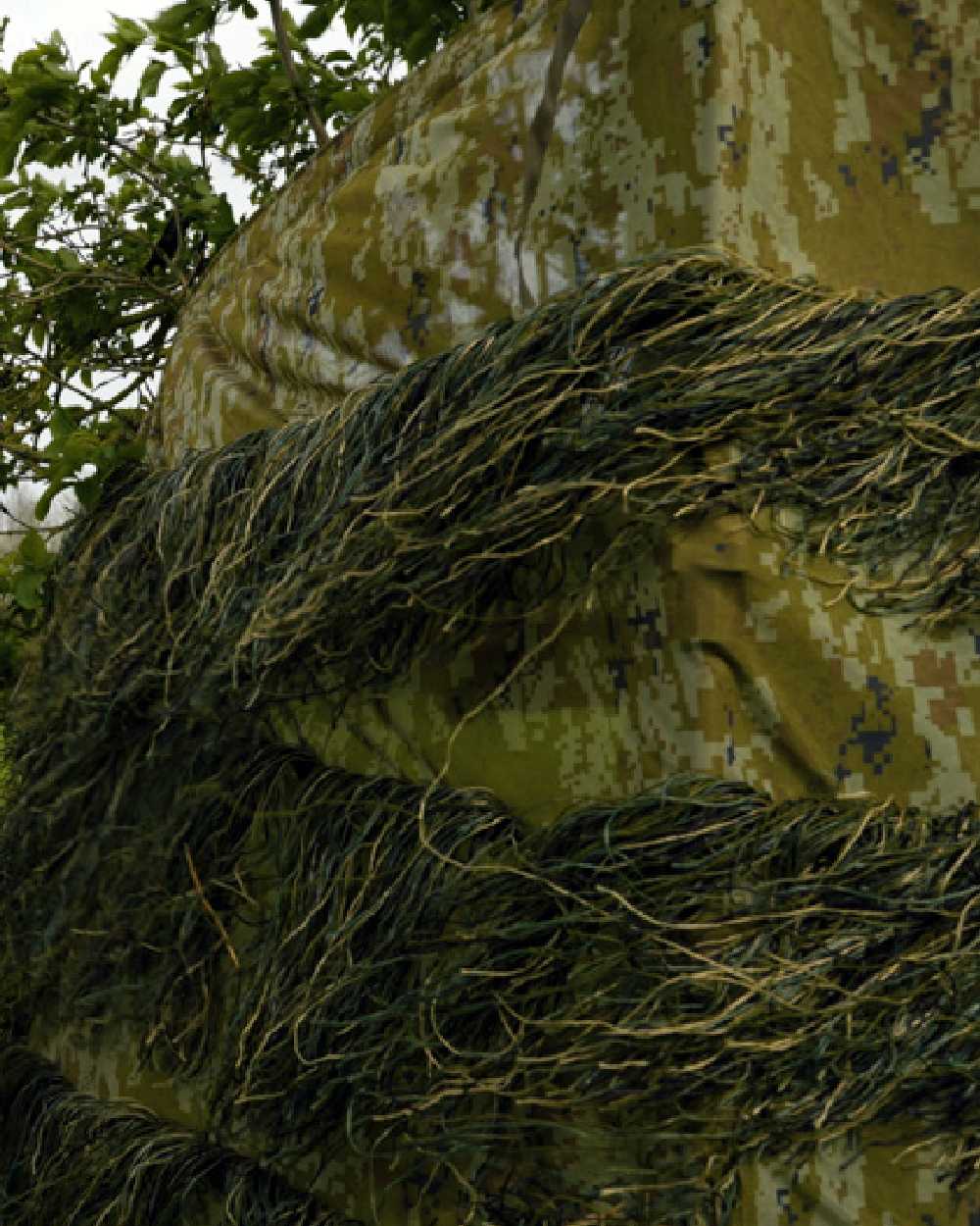 Camo coloured Jack Pyke Ghillie Hide Net on forest background #colour_camo