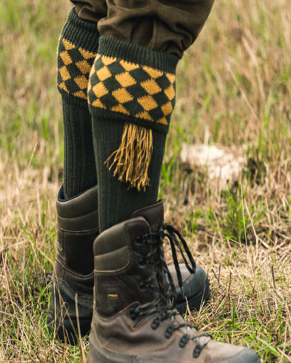 Green Coloured Jack Pyke Harlequin Socks on outdoor background #colour_green