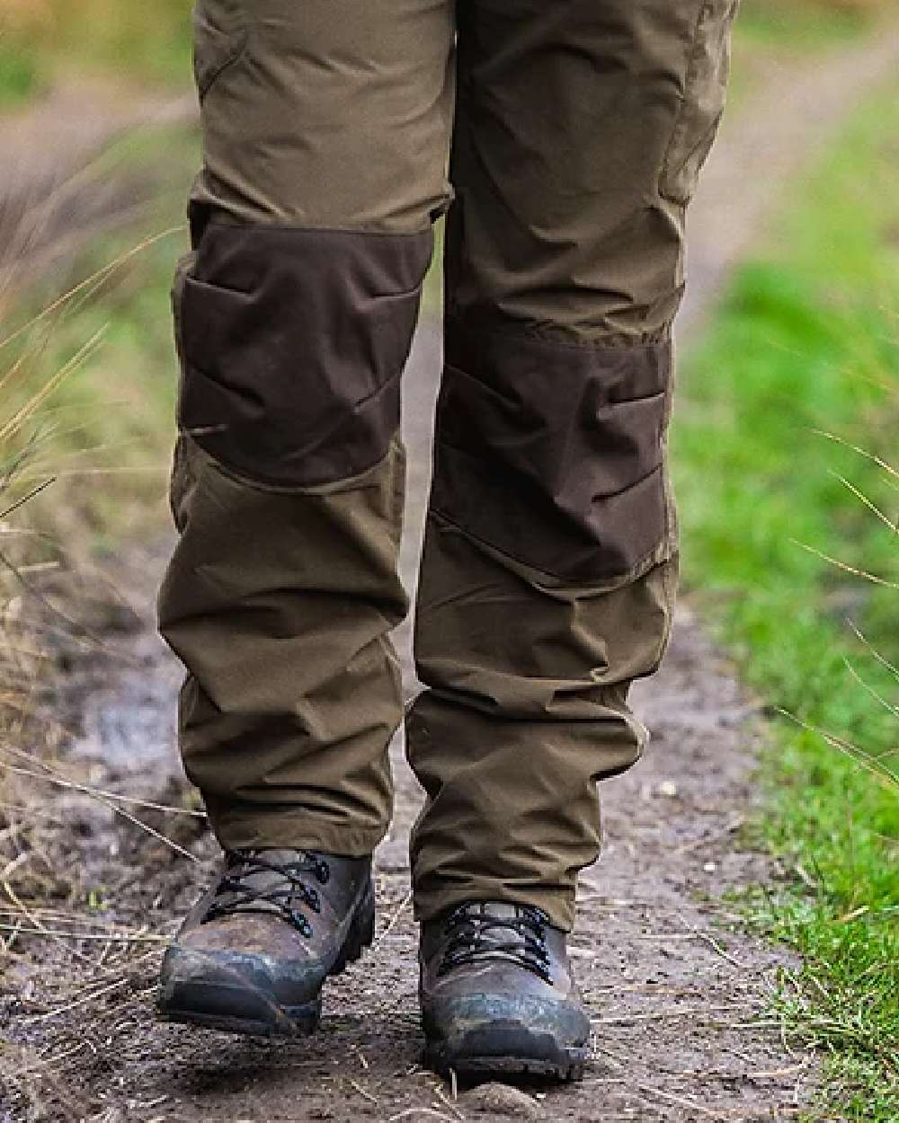 Brown coloured Jack Pyke Hunters Boots on soil background #colour_brown