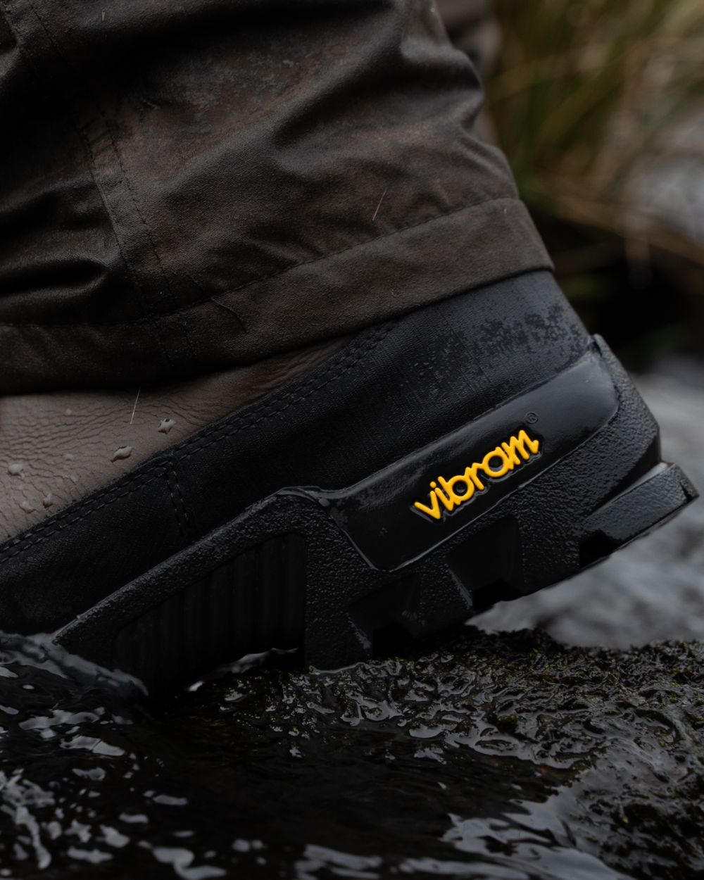 Brown coloured Jack Pyke Hunters Boots on water background #colour_brown