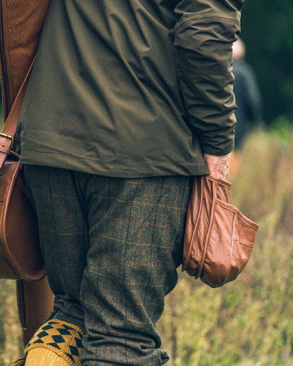 Tan coloured Jack Pyke Leather Cartridge Pouch on forest background #colour_tan