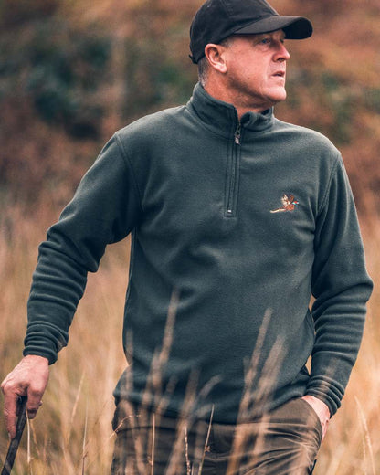 Green coloured Jack Pyke Pheasant Motif Fleece Pullover on blurry background #colour_green