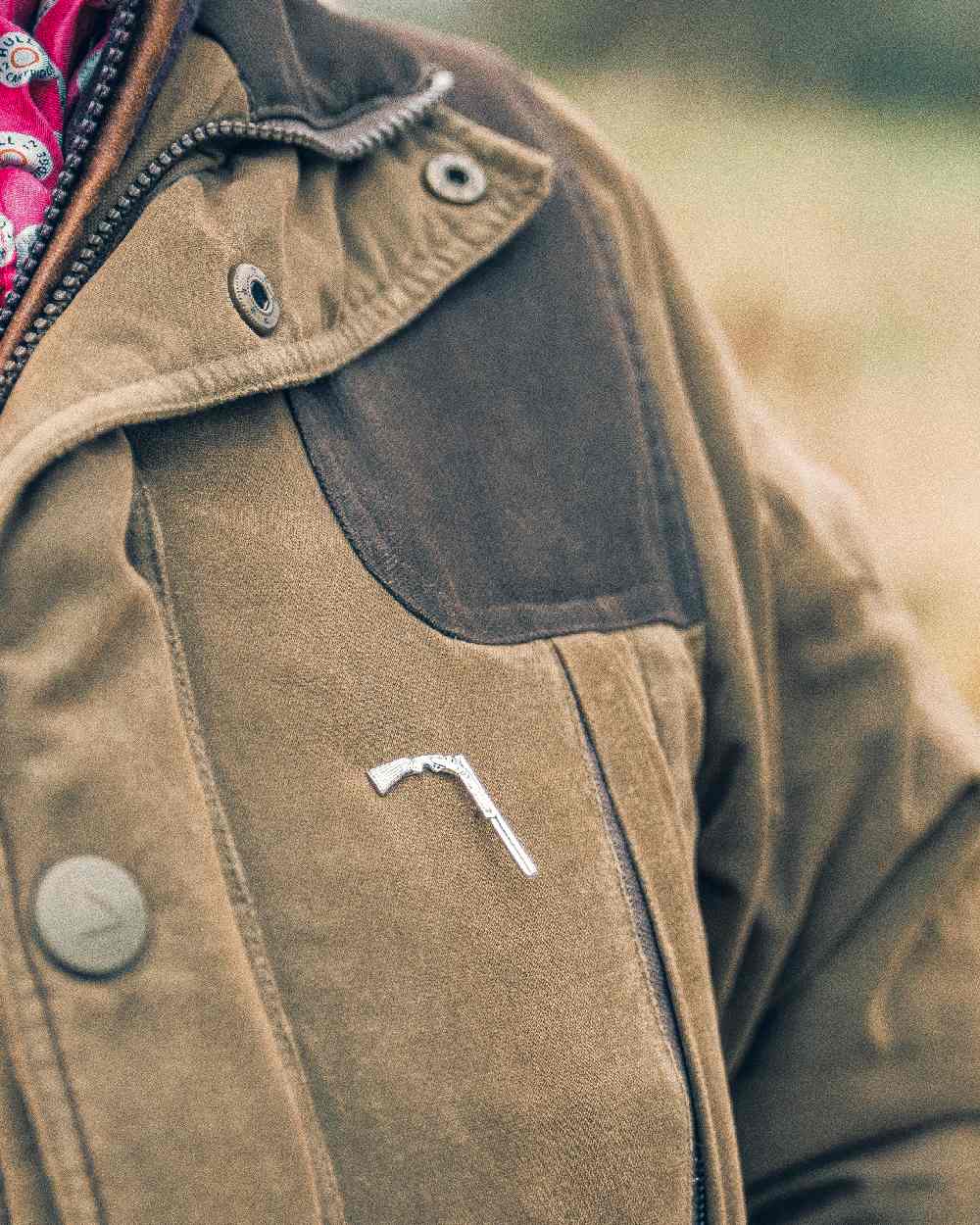 Shotgun styled Jack Pyke Pin Badge on blurry background #style_shotgun