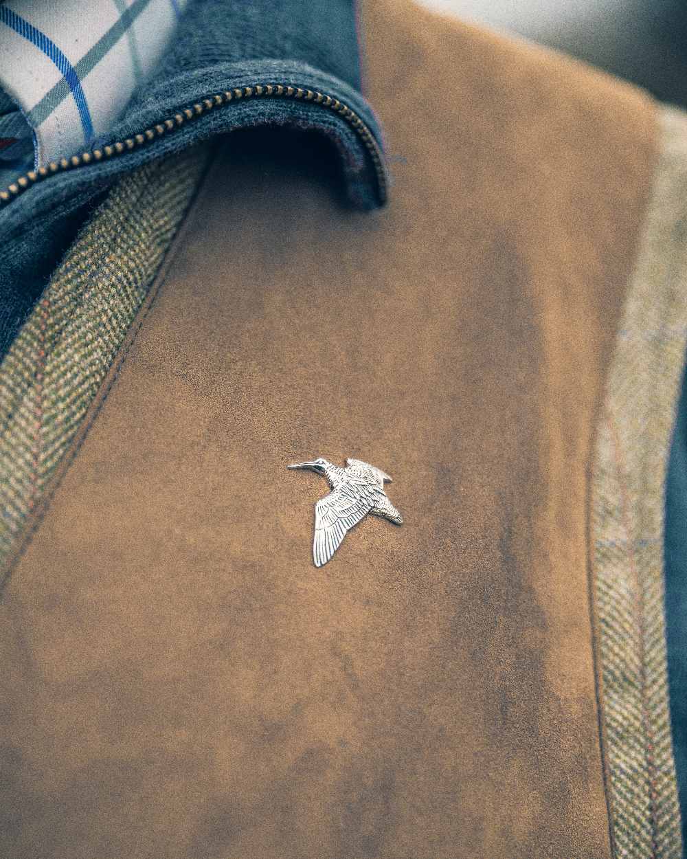 Woodcock styled Jack Pyke Pin Badge on blurry background #style_woodcock