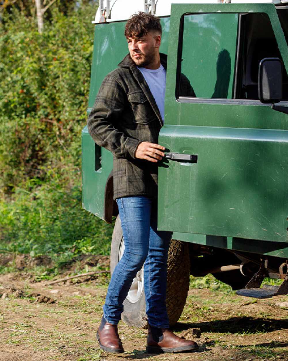 Green Check coloured Jack Pyke Polar Fleece Shirt on tree background #colour_green-check