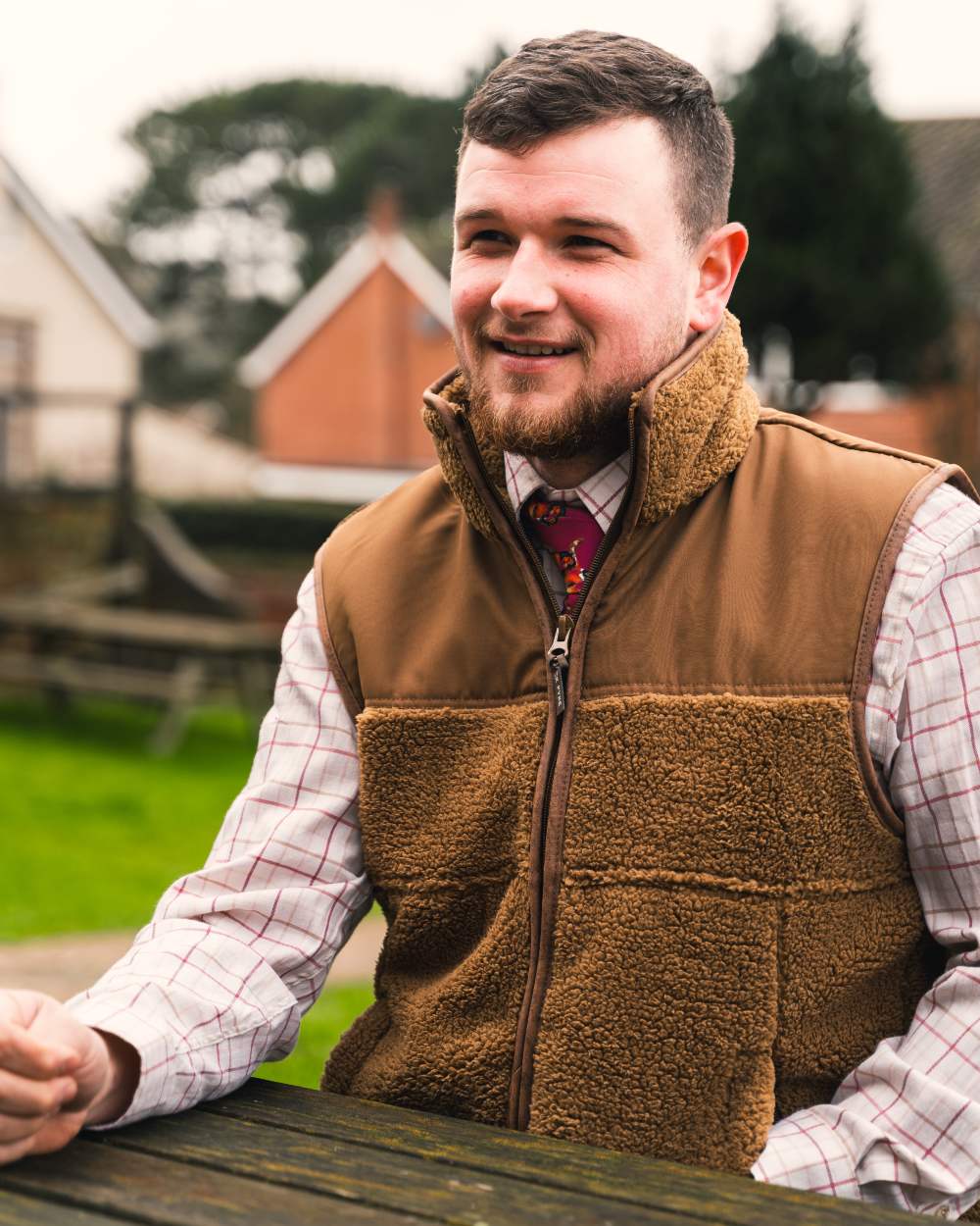 Camel coloured Jack Pyke Sherpa Fleece Gilet on house background #colour_camel