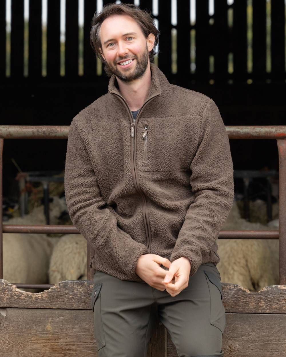 Green coloured Jack Pyke Shires Fleece Jacket on yard background #colour_green