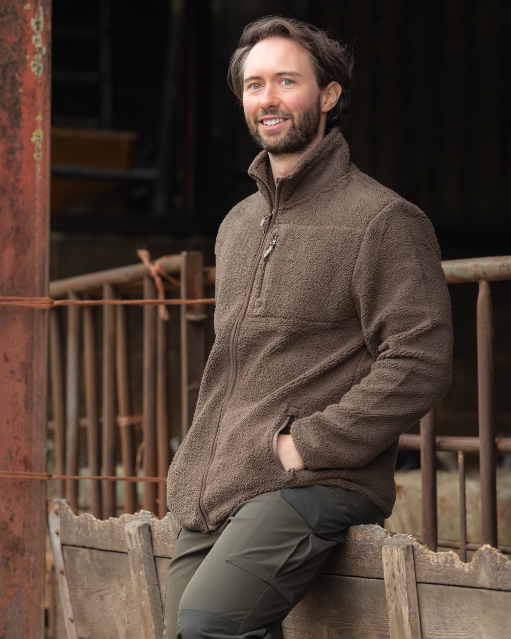 Green coloured Jack Pyke Shires Fleece Jacket on yard background #colour_green