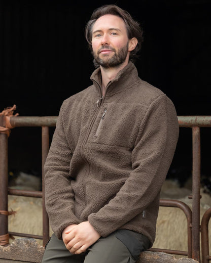 Green coloured Jack Pyke Shires Fleece Jacket on yard background #colour_green