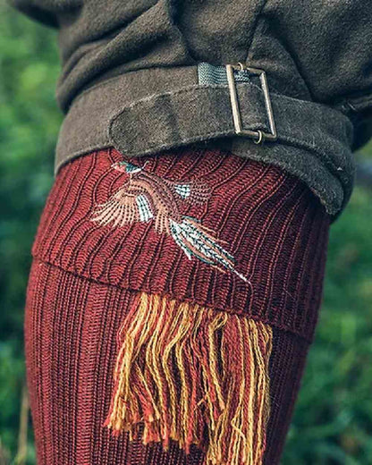 Burgundy coloured Jack Pyke Shooting Socks Pheasant on blurry background #colour_burgundy