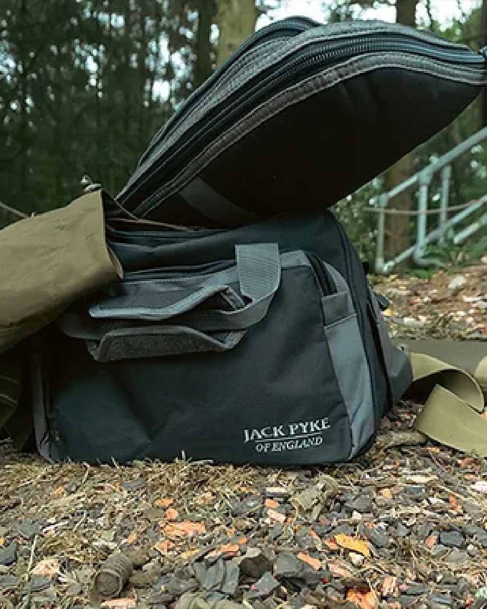 Black coloured Jack Pyke Sporting Shoulder Bag on forest background #colour_black
