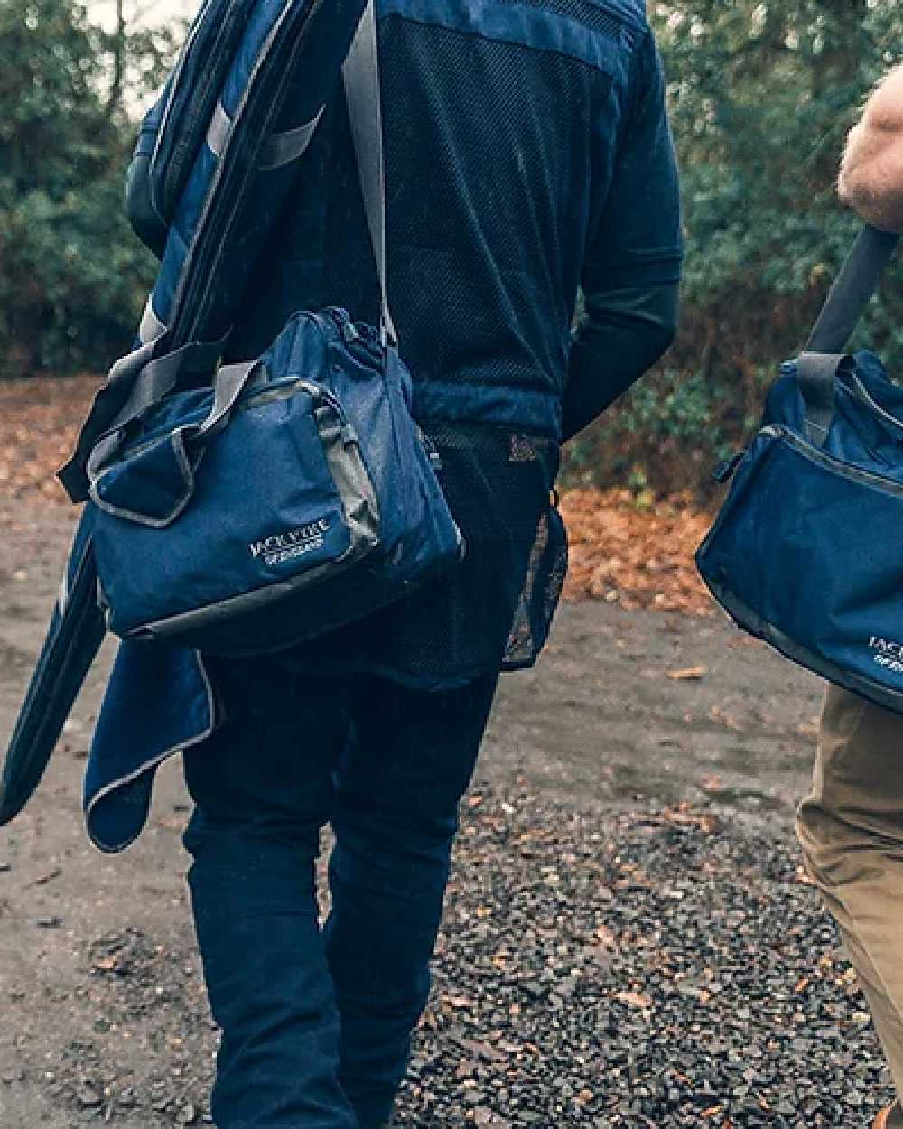Blue coloured Jack Pyke Sporting Shoulder Bag on road background #colour_blue