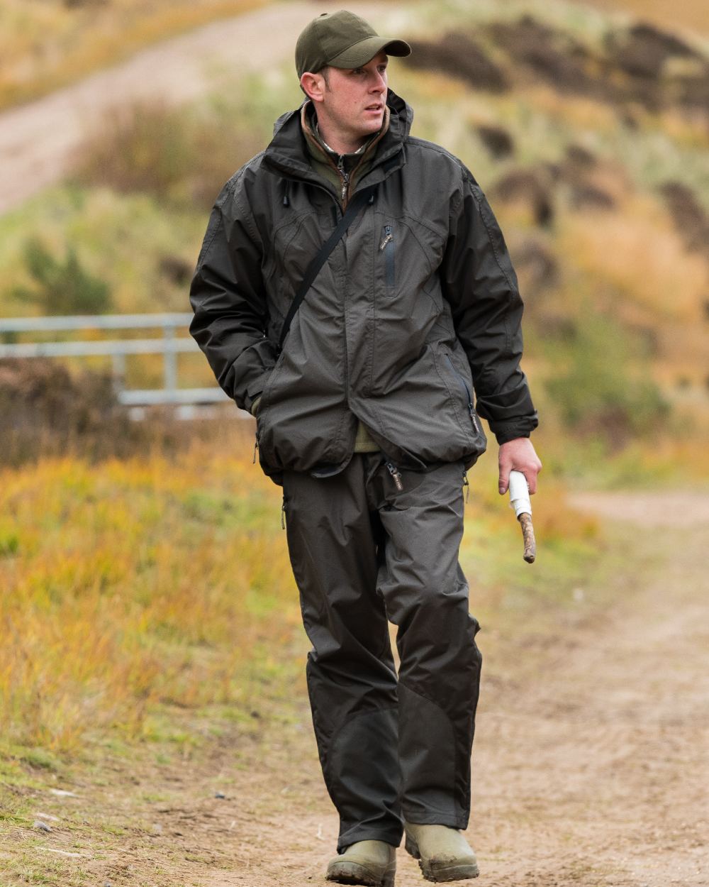 Hunter Green coloured Jack Pyke Technical Featherlite Jacket on mountain background #colour_hunter-green