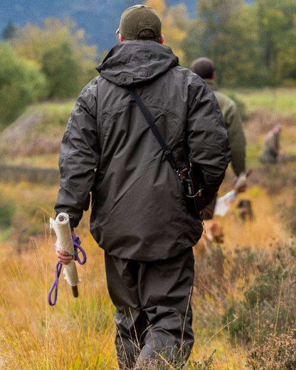 Hunter Green coloured Jack Pyke Technical Featherlite Jacket on mountain background #colour_hunter-green