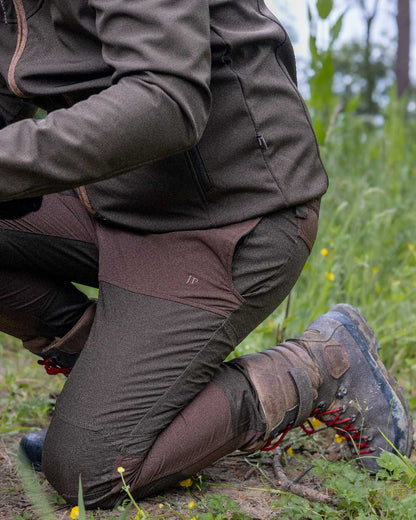 Brown coloured Jack Pyke Technical Hybrid Trousers on outdoor background #colour_brown