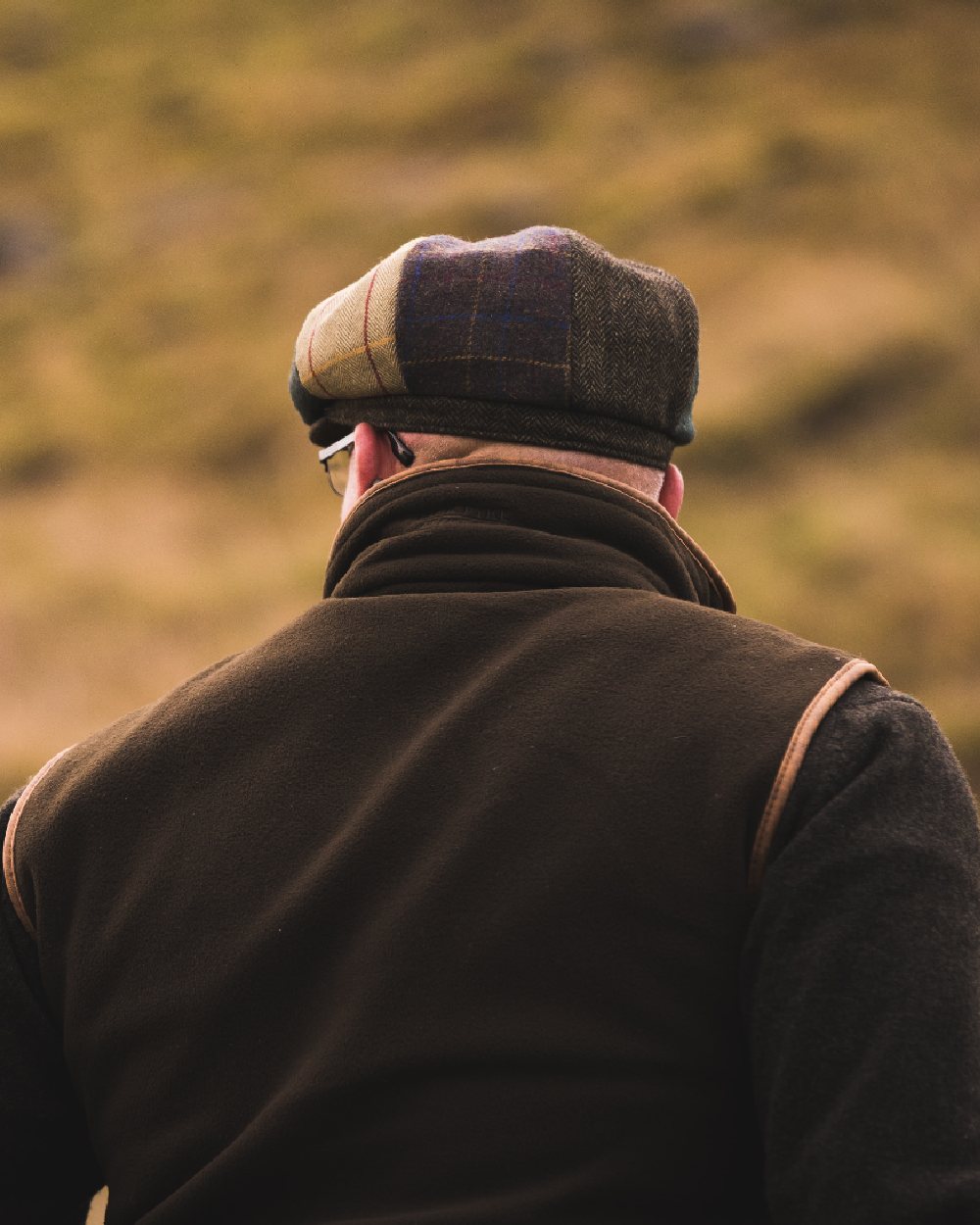 Brown Check coloured Jack Pyke Wool Blend Baker Boy Hat on blurry background #colour_brown-check