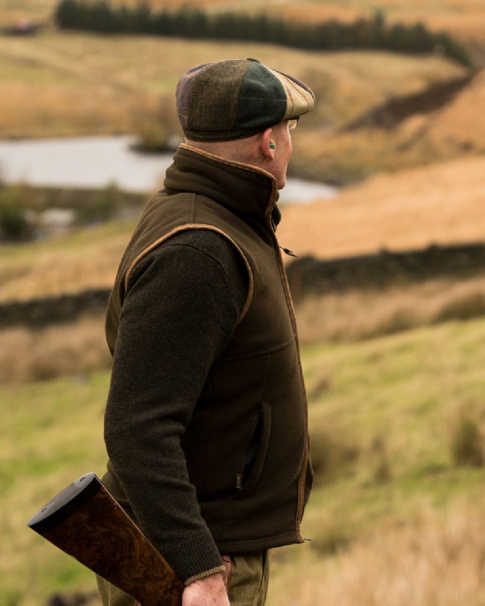 Tweed Brown coloured Jack Pyke Wool Blend Baker Boy Hat on blurry background #colour_tweed-brown