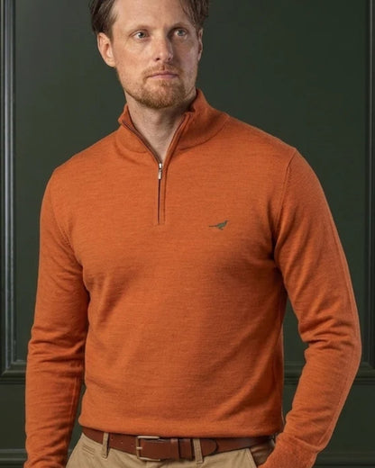 Orange Coloured Laksen Norfolk Zip Neck Merino Sweater on indoor background #colour_orange