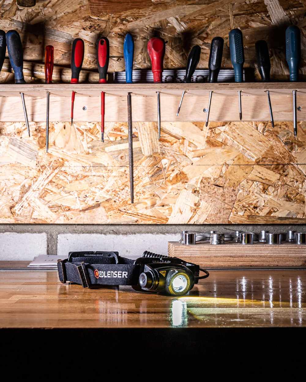 Black Coloured Led Lenser H5R Core Head Torch on wooden table background #colour_black