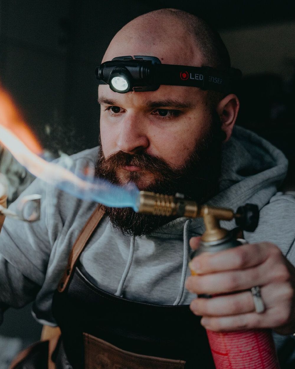 Black Coloured Led Lenser H5R Core Head Torch on blurry background #colour_black