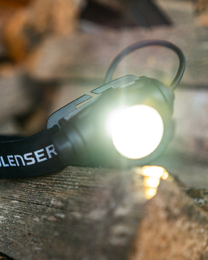 Black Coloured Led Lenser H7R Core Head Torch on blurry background #colour_black